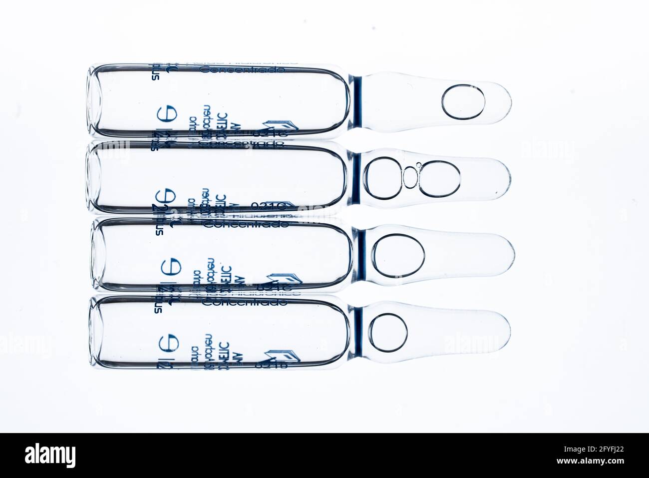 Glass ampoules of hyaluronic acid, hyaluronic acid is a polysaccharide found in the joint spaces, where it acts as a lubricant, and is also a major co Stock Photo