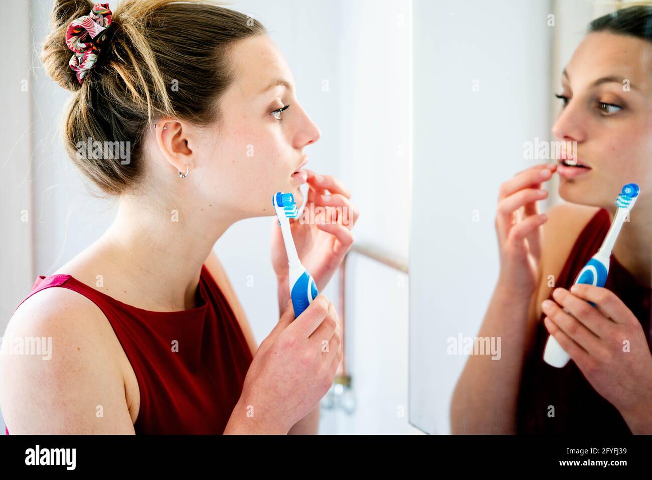 Woman brushing her teeth. Stock Photo