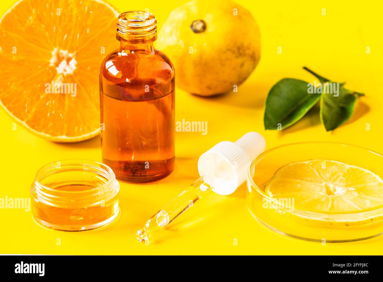 Illustration on the use of vitamin C in the manufacture of cosmetics. Stock Photo