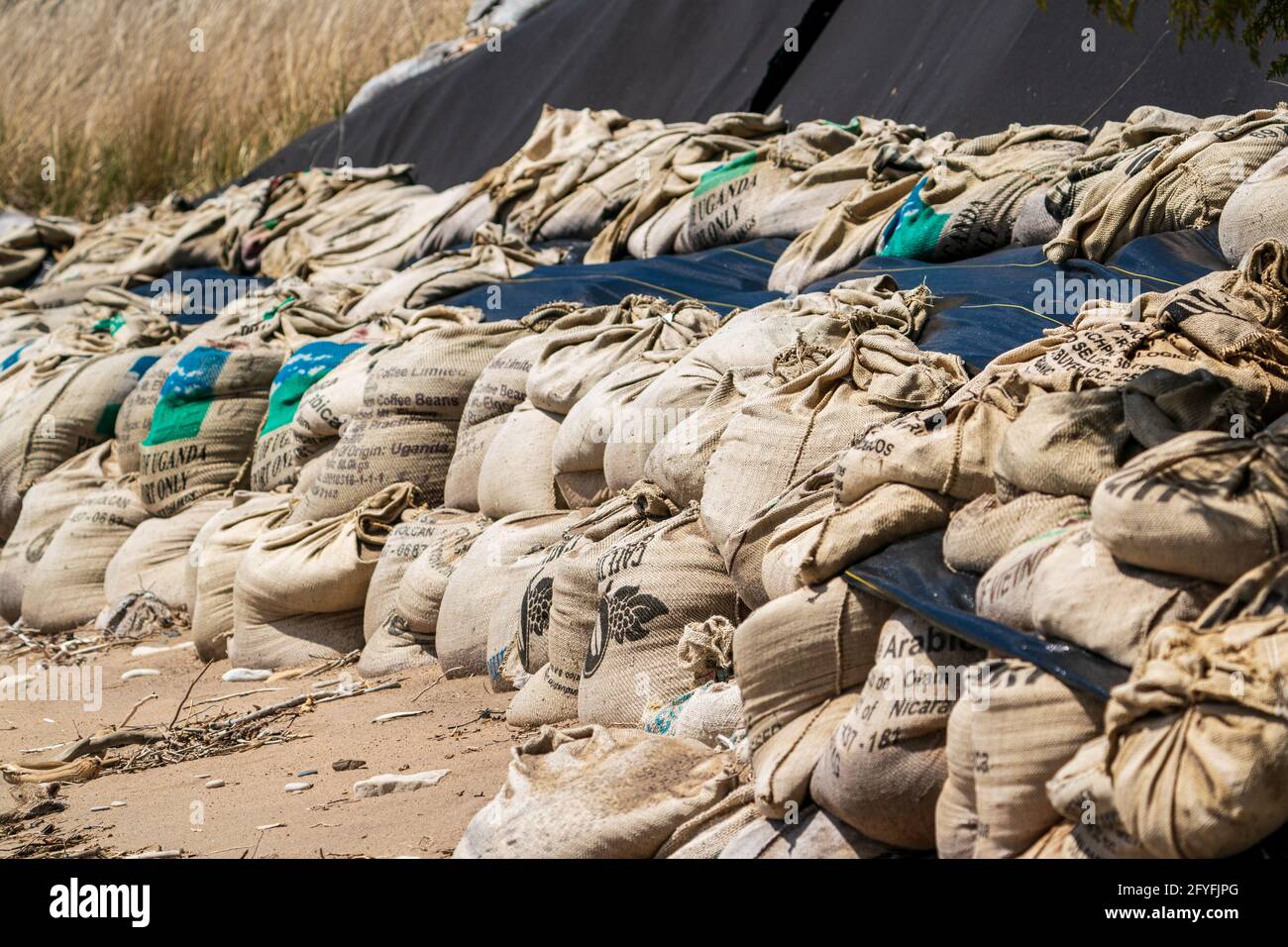 These sand filler coffee bags are an example of what homeowners are doing to combat the rising water levels along the shores of Lake Michigan. Stock Photo