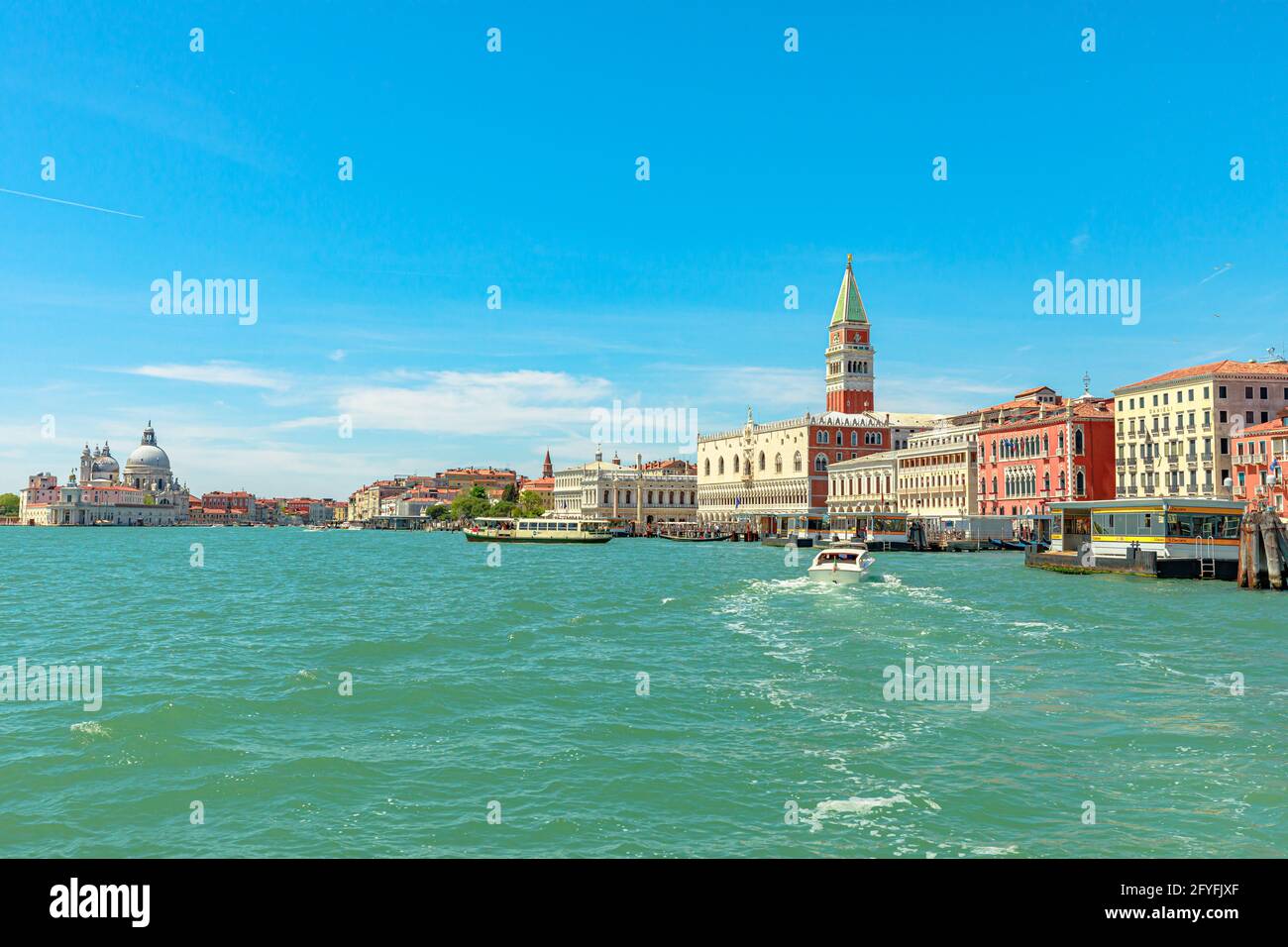 Venice, Italy - May 9, 2021: San Marco bell tower in San Marco square in Venice with Saint Mark Basilica of Venetian italian town. sea view from Stock Photo