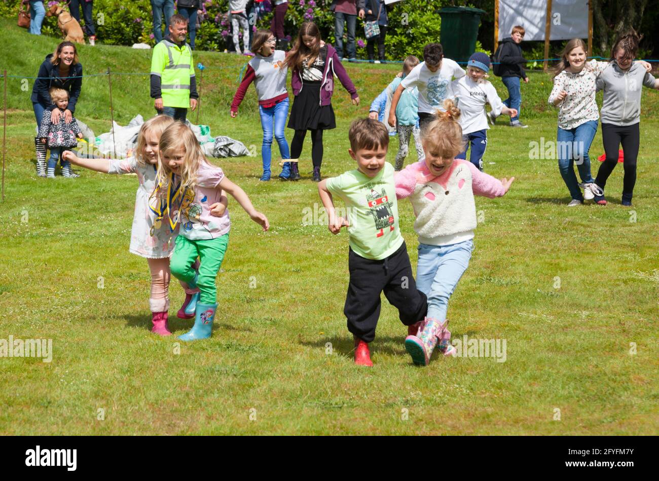 Three legged race at childrens sports at Rhu Gala, Argyll, Scotland