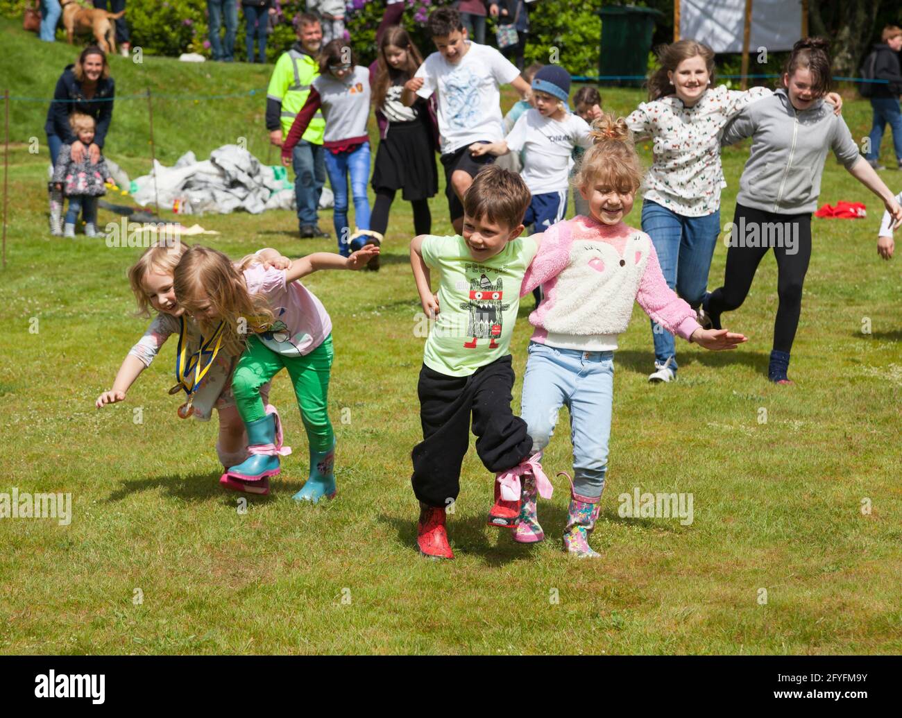 Three legged race at childrens sports at Rhu Gala, Argyll, Scotland Stock Photo