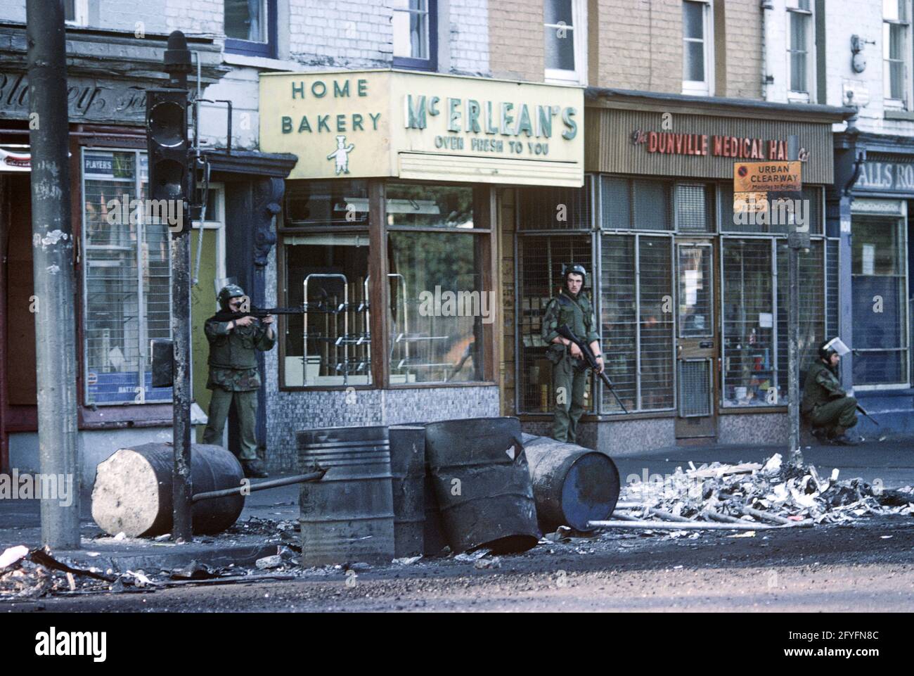 BELFAST, UNITED KINGDOM - AUGUST 1976, British Army Troops during Rioting on the Falls Road, West Belfast, The Troubles, Northern Ireland, 1970s Stock Photo