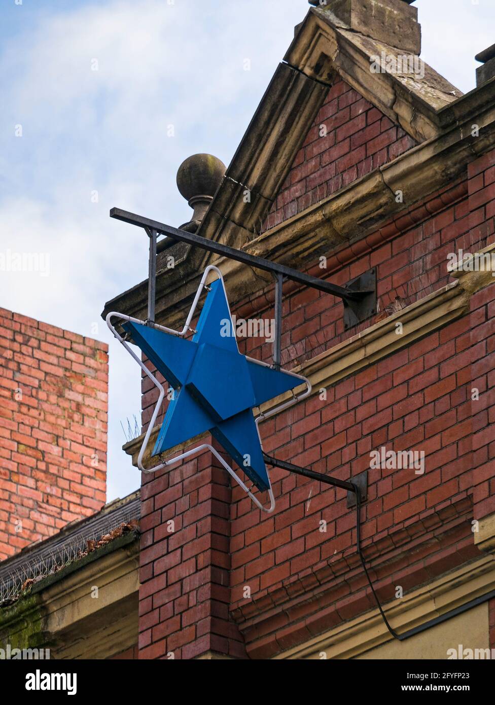 The blue star was a symbol of Scottish and Newcastle breweries before their takeover by Heineken Carlsberg in 2008 Stock Photo
