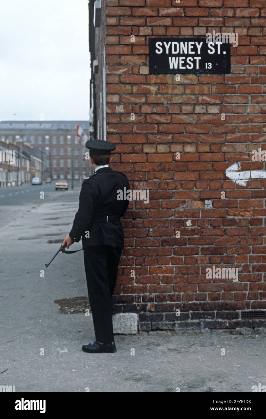 BELFAST, UNITED KINGDOM - SEPTEMBER 1978. RUC, Royal Ulster Constabulary, policeman on Patrol of East Belfast Streets during The Troubles, Northern Ireland, 1970s Stock Photo