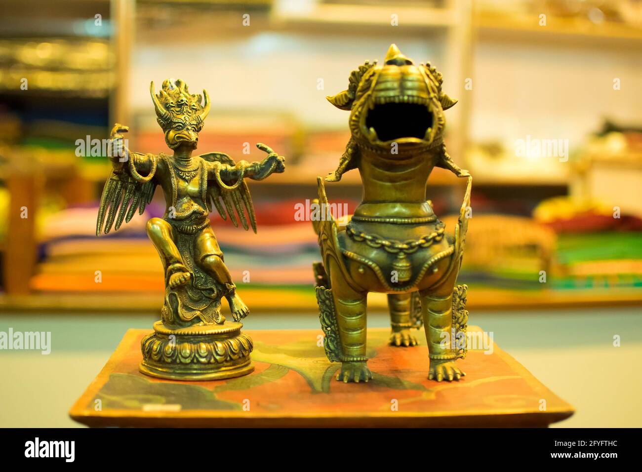 Chinese emperor with a snake and dragon by side, toys on display at local market , Leh, Ladakh, India. These toys are popular for Ladakhi people. Stock Photo