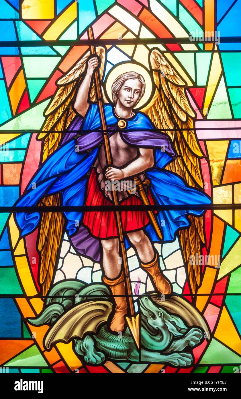 Catholic image in stained glass.  The Archangel Gabriel is depicted in colorful stained glass at the Annunciation Catholic Church in Toronto. Stock Photo
