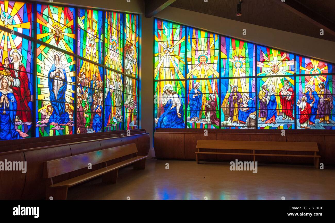 Inside details of Annunciation Catholic Church.  Colorful Stained glass windows depict scenes from the Bible for in Toronto. Stock Photo
