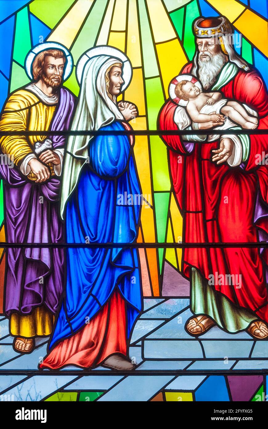 Nativity scene: Christian scenes in stained glass following the catholic traditions, beautiful multicolor stained glass in the Catholic church Stock Photo