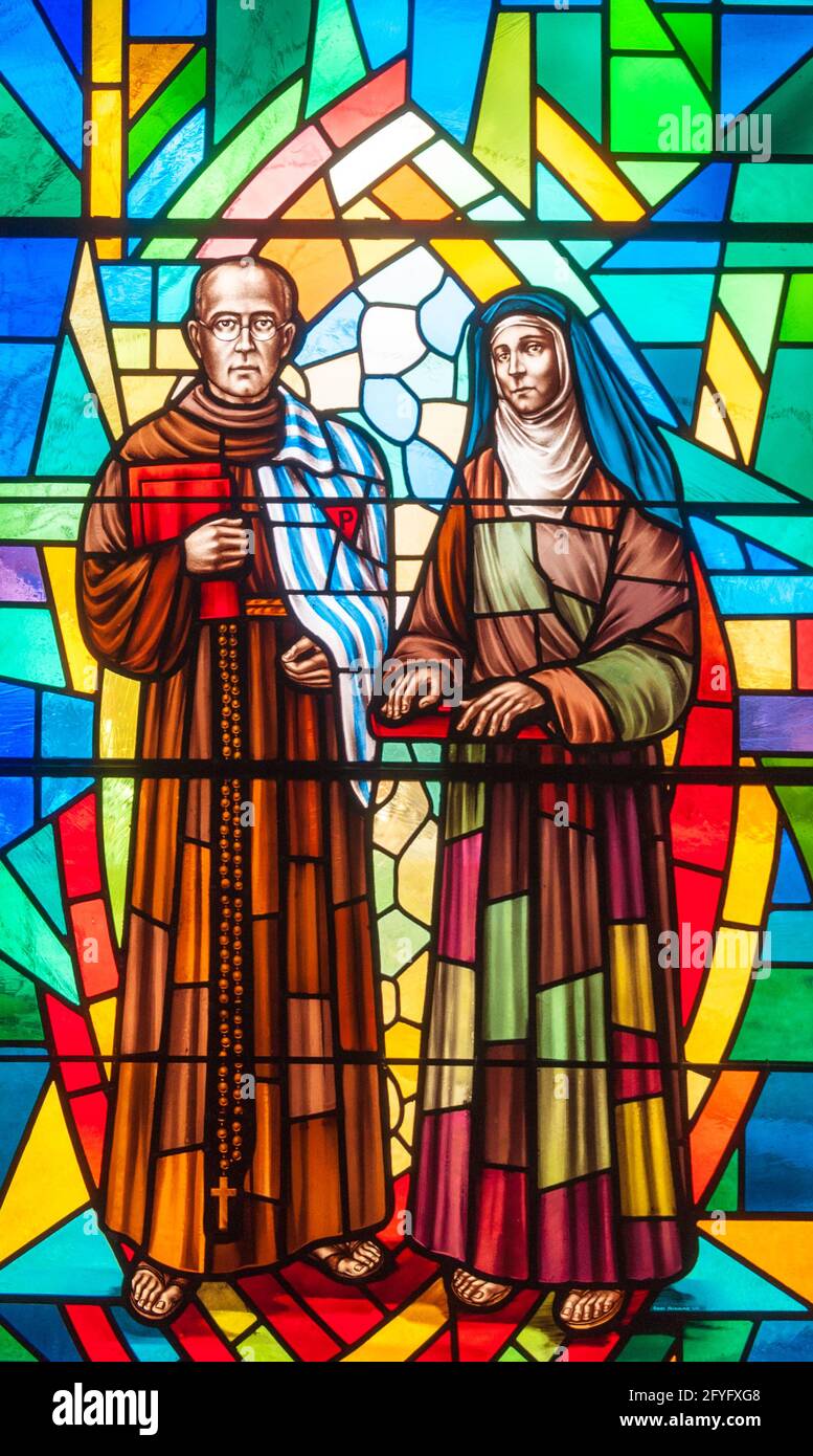 Catholic image in stained glass.  Joseph and the Virgin Mary are surrounded by the colorful glass at the Annunciation Catholic Church in Toronto. Stock Photo