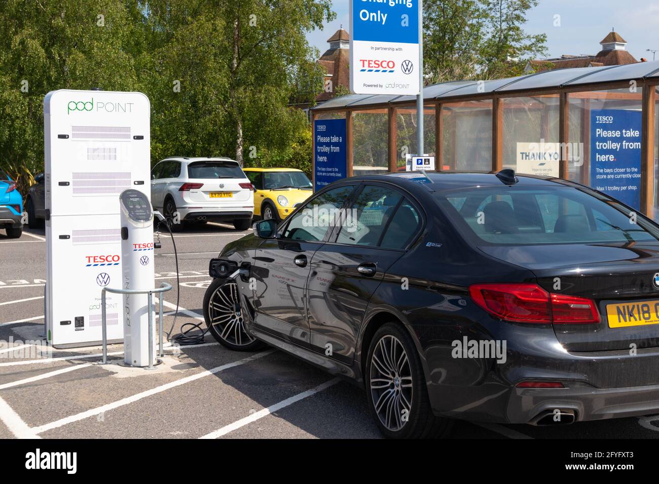 Tesco electric car charging station, powered by pod point, tenterden, kent, uk Stock Photo