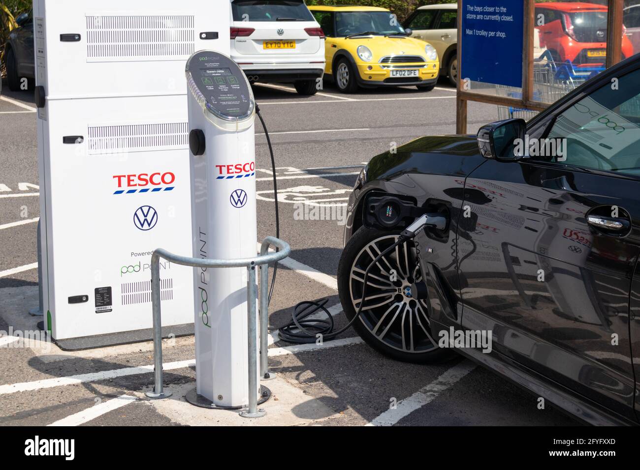 Tesco electric car charging station, powered by pod point, tenterden, kent, uk Stock Photo