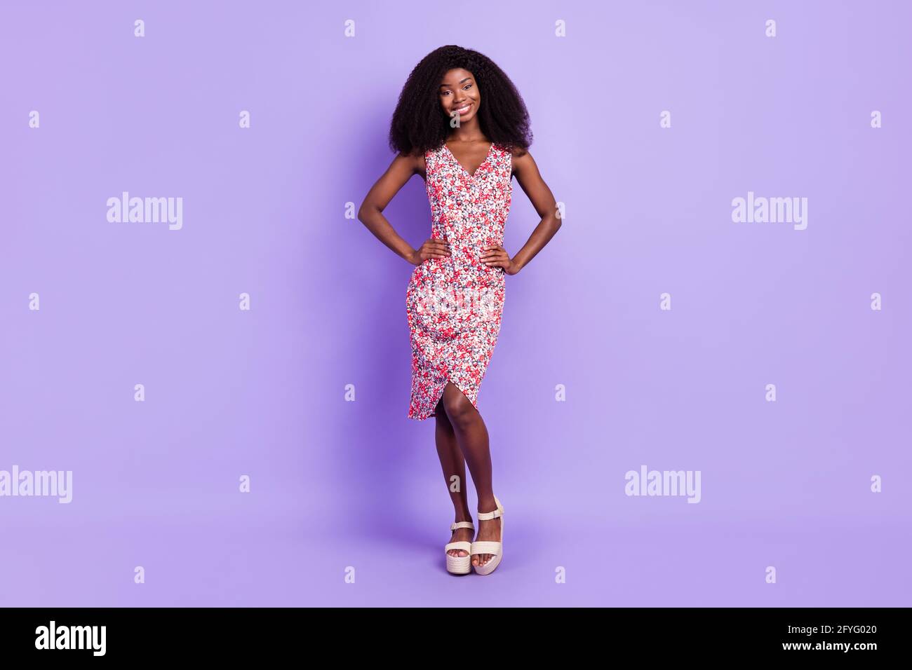 Full length body size photo of smiling woman wearing floral dress isolated on pastel violet color background Stock Photo Alamy