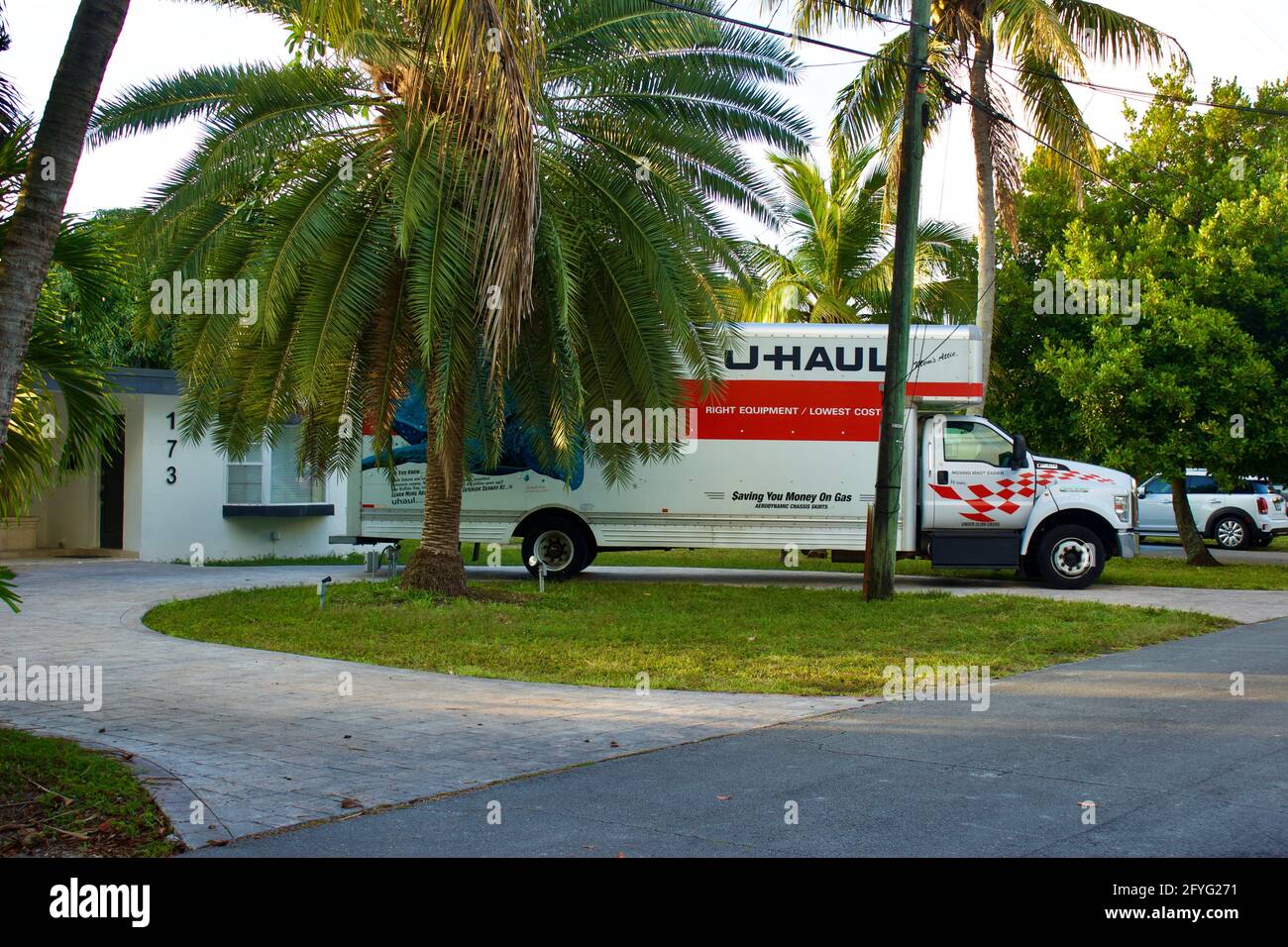 U-Haul straight truck backed into driveway of residential address Stock Photo