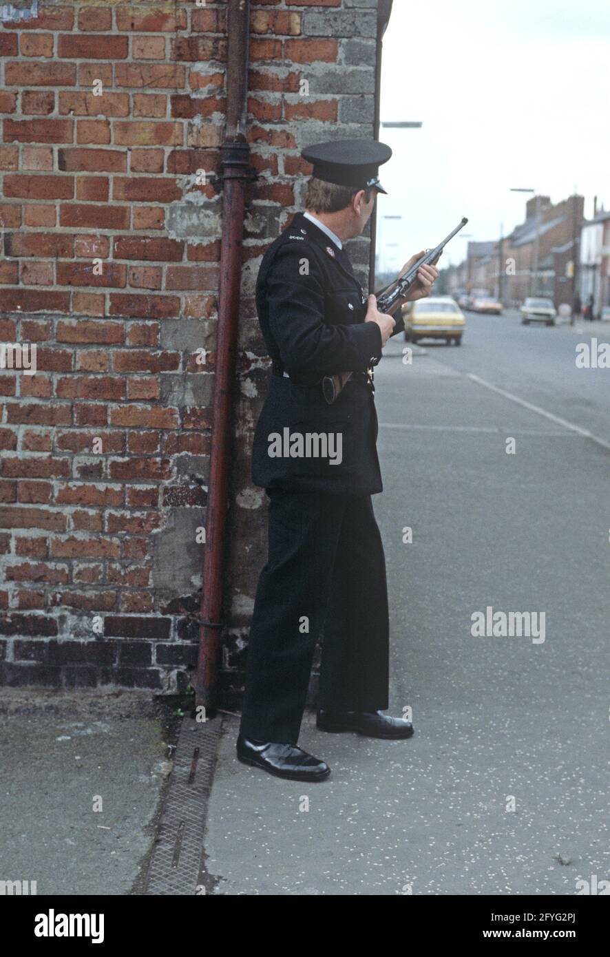 BELFAST, UNITED KINGDOM - SEPTEMBER 1978. RUC, Royal Ulster Constabulary, policeman on Patrol of East Belfast Streets during The Troubles, Northern Ireland, 1970s Stock Photo
