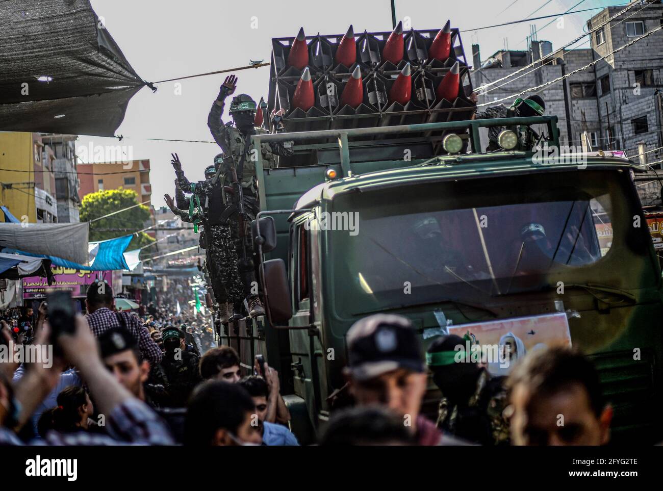 Gaza, Palestine. 27th May, 2021. Members of the Izz al-Din al-Qassam Brigades, the military wing of Hamas display rockets during a military parade on the Streets in Khan Yunis, southern Gaza Strip. Credit: SOPA Images Limited/Alamy Live News Stock Photo