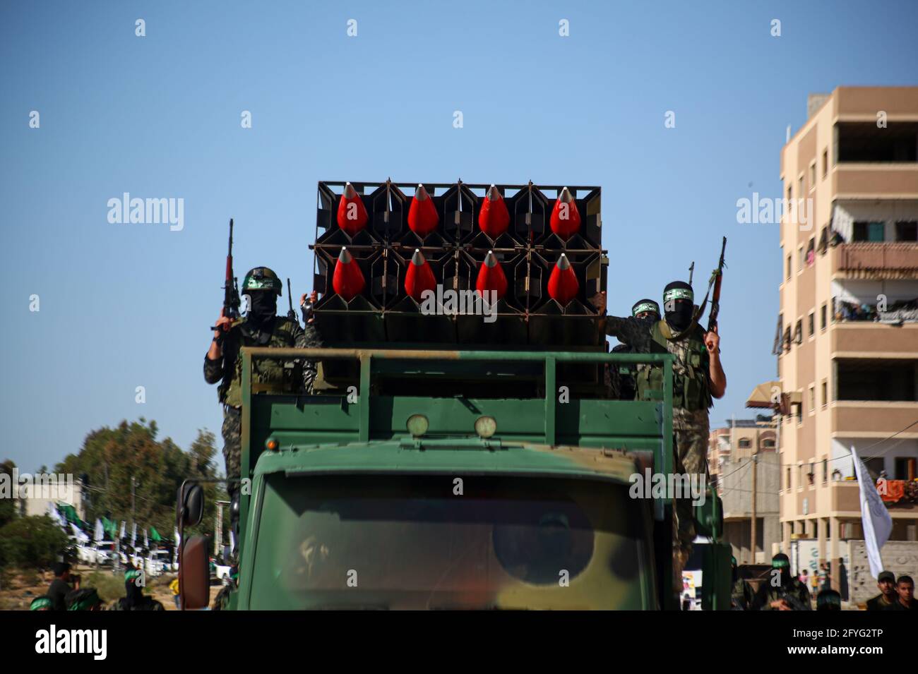 Gaza, Palestine. 27th May, 2021. Members of the Izz al-Din al-Qassam Brigades, the military wing of Hamas display rockets during a military parade on the Streets in Khan Yunis, southern Gaza Strip. Credit: SOPA Images Limited/Alamy Live News Stock Photo