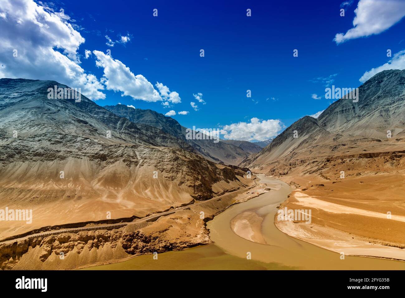 Scenic view of Confluence of Zanskar river from left and Indus rivers from up right - Leh, Ladakh, Jammu and Kashmir, India. Famous tourist spot of La Stock Photo