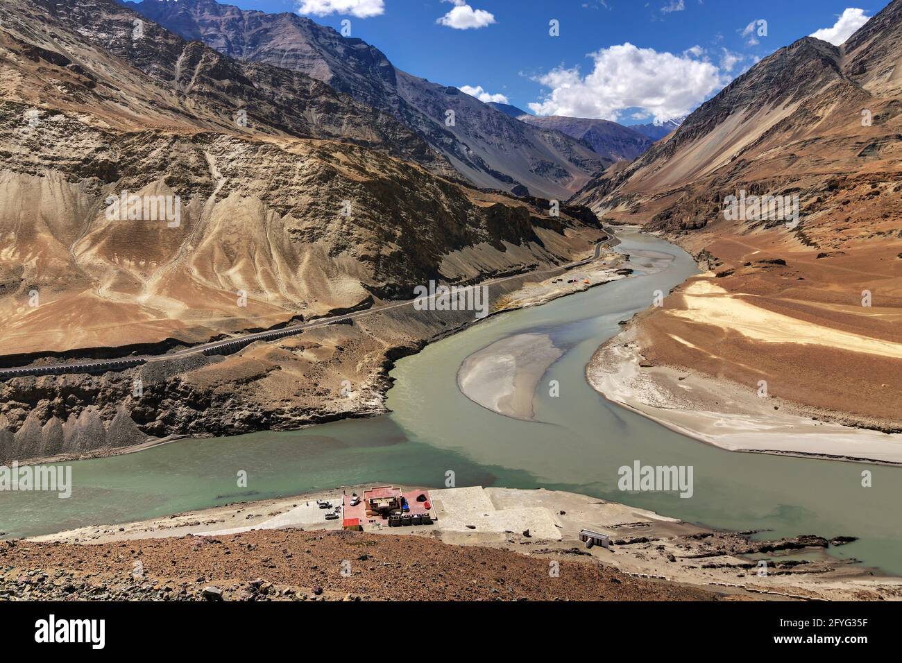 Scenic view of Confluence of Zanskar river from left and Indus rivers from up right - Leh, Ladakh, Jammu and Kashmir, India. Famous tourist spot. Stock Photo