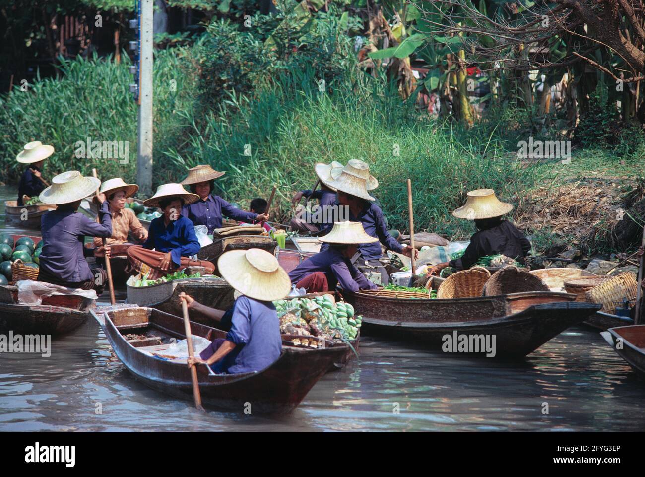 Thailand. Bangkok. Floating market. Women traders in canoes. Stock Photo