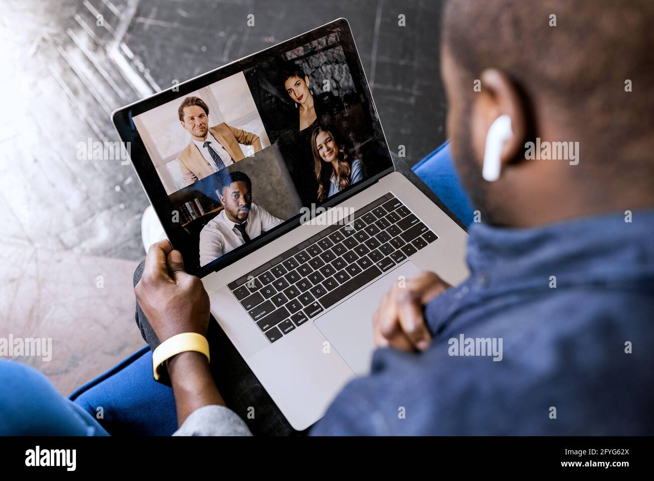 Back view of African american male speak on video call with colleagues ...