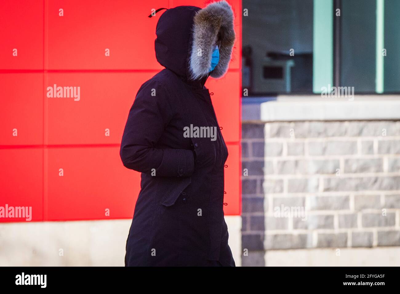 A person wears a mask in Kingston, Ontario on Friday, January 8, 2021, as the COVID-19 pandemic continues across Canada and around the world. Stock Photo
