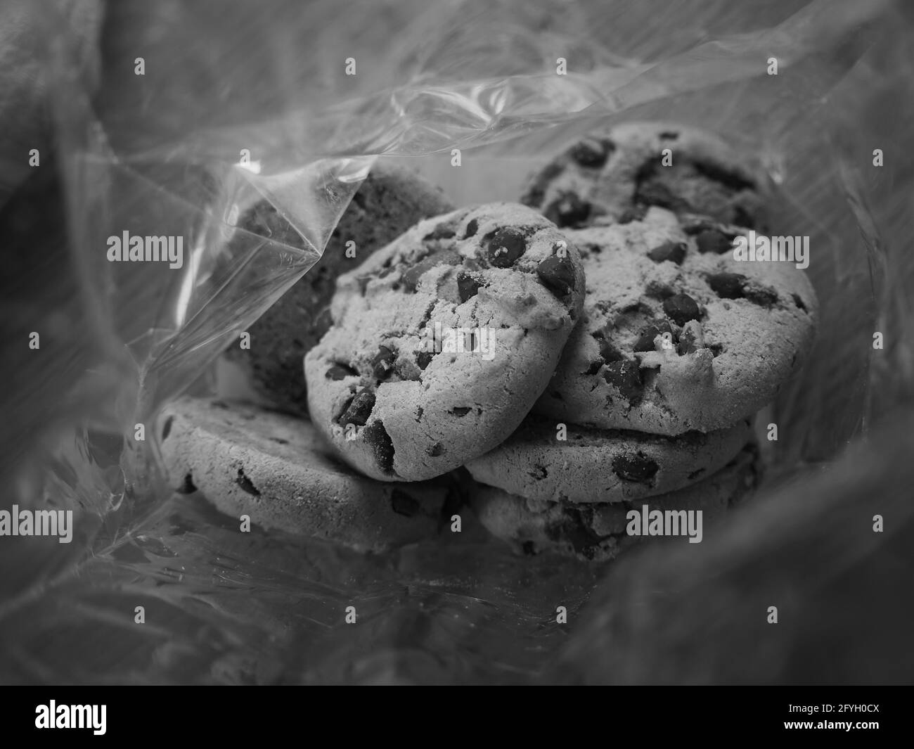Grayscale of chocolate chip cookies in plastic bag Stock Photo