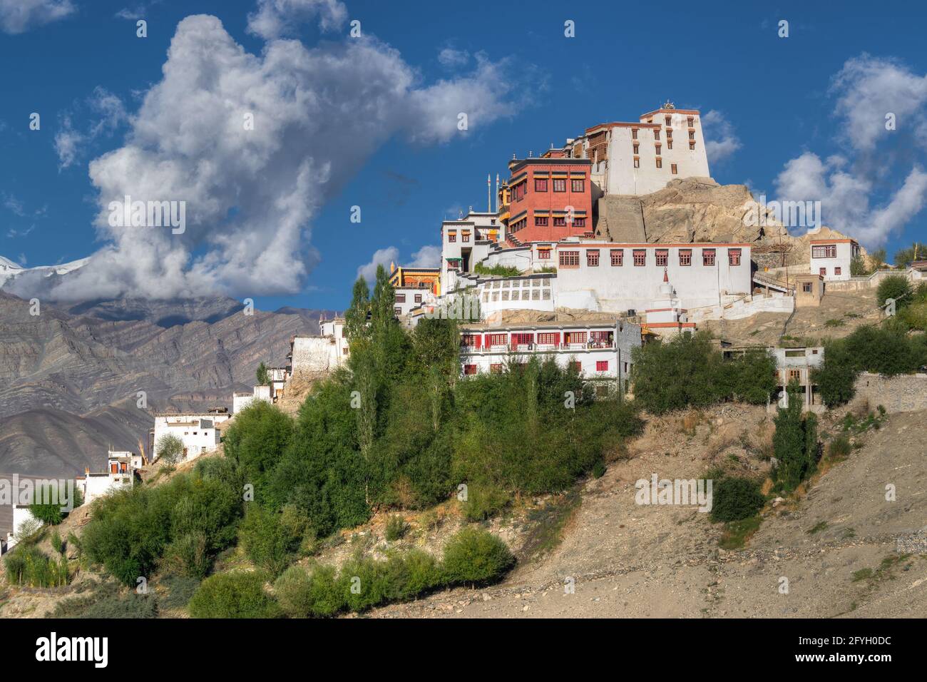 Thiksay monastery with view of Himalayan mountians and blue sky in background,Ladakh,Jammu and Kashmir, India Stock Photo