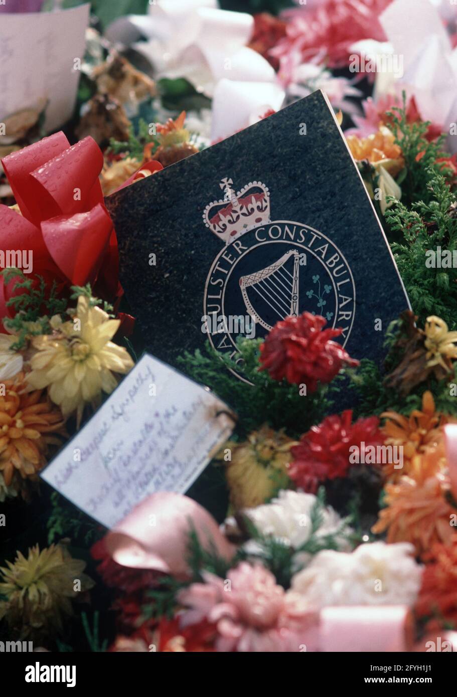 COUNTY FERMANAGH, UNITED KINGDOM - OCTOBER 1980, Floral Wreaths on RUC, Royal Ulster Constabulary, policeman's grave who was shot by the IRA, Northern Ireland, 1970s Stock Photo