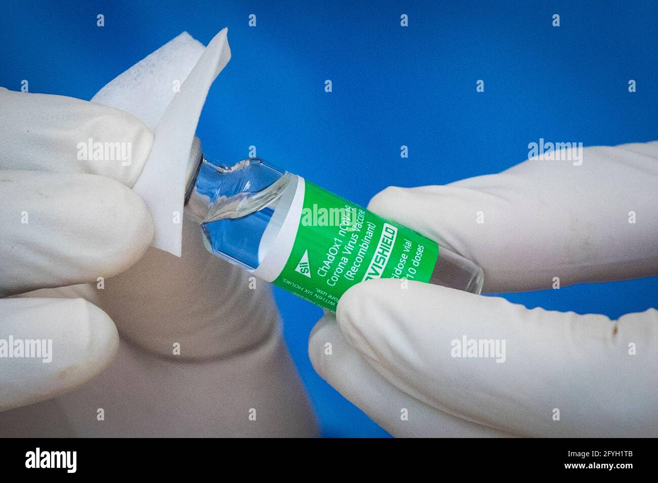 A vial of the AstraZeneca COVID-19 vaccine is cleaned before use at a pharmacy in Kingston, Ontario on Thursday, March 18, 2021, as the COVID-19 pande Stock Photo