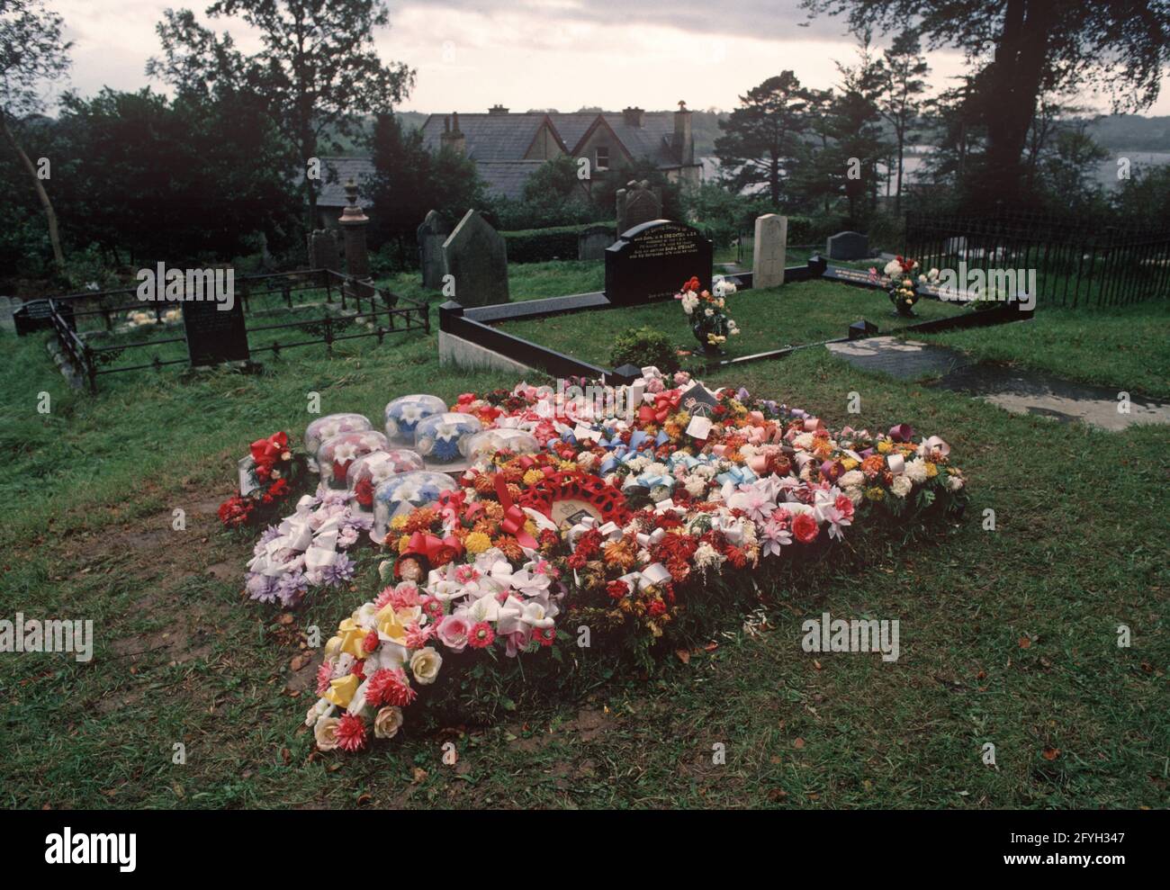 COUNTY FERMANAGH, UNITED KINGDOM - OCTOBER 1980, Floral Wreaths on RUC, Royal Ulster Constabulary, policeman's grave who was shot by the IRA, Northern Ireland, 1970s Stock Photo