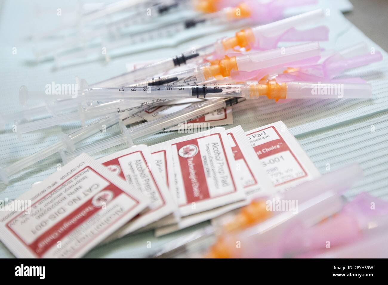 Syringes and disinfection wipes at the COVID-19 vaccine clinic at the Strathcona Paper Centre at the Strathcona Paper Centre in Napanee, Ontario on Mo Stock Photo