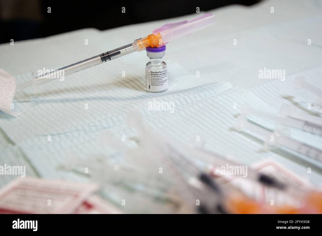 A vial and a syringe with the Pfizer-BioNTech COVID-19 vaccine in Napanee, Ontario on Monday, March 15, 2021, as the COVID-19 pandemic continues acros Stock Photo