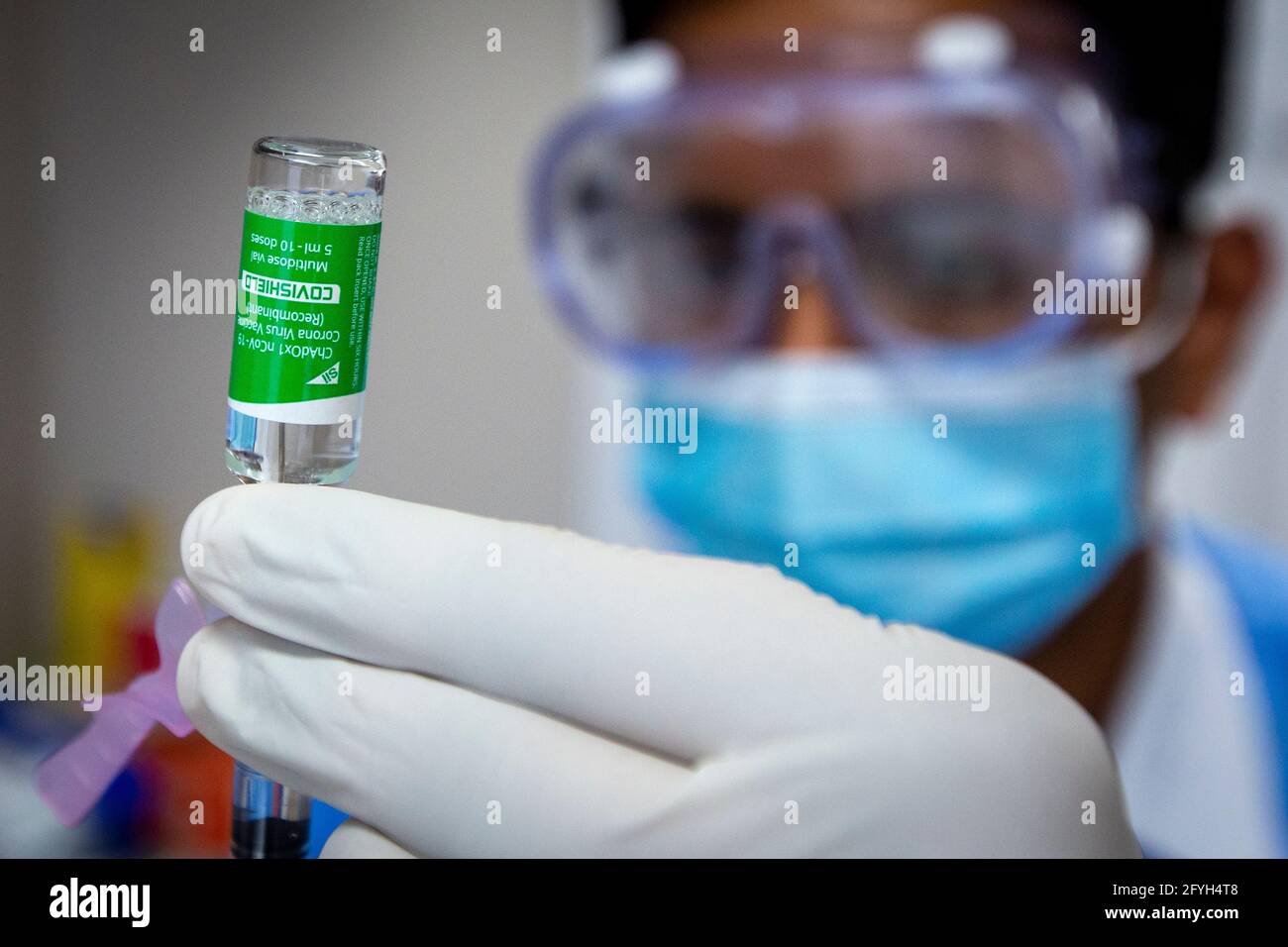 The AstraZeneca COVID-19 vaccine is being withdrawn with a syringe before use at a pharmacy in Kingston, Ontario on Thursday, March 18, 2021, as the C Stock Photo