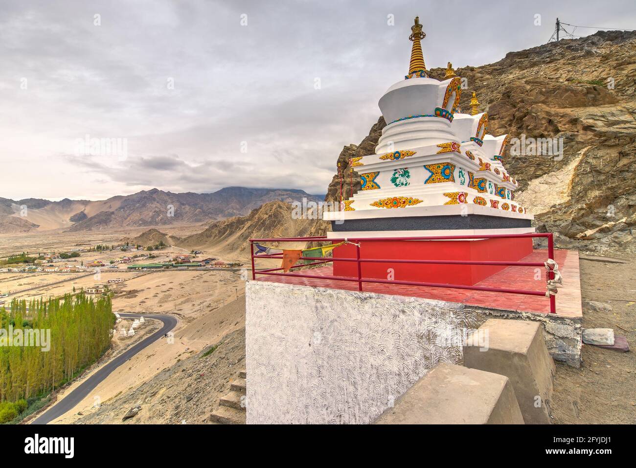 Thiksay monastery with view of Himalayan mountians and blue sky with white clouds in background,Ladakh,Jammu and Kashmir, India Stock Photo