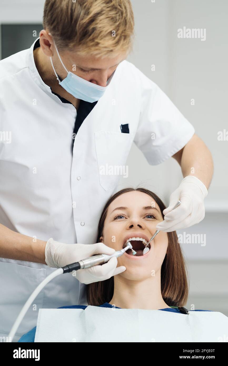 Overview of dental caries prevention. Girl at the dentist chair during