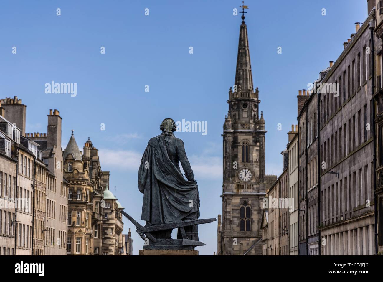 A photograph looking down the Royal Mile in Edinburgh. The view is the rear of a statue of the economist Adam Smith by Alexander Stoddart Stock Photo