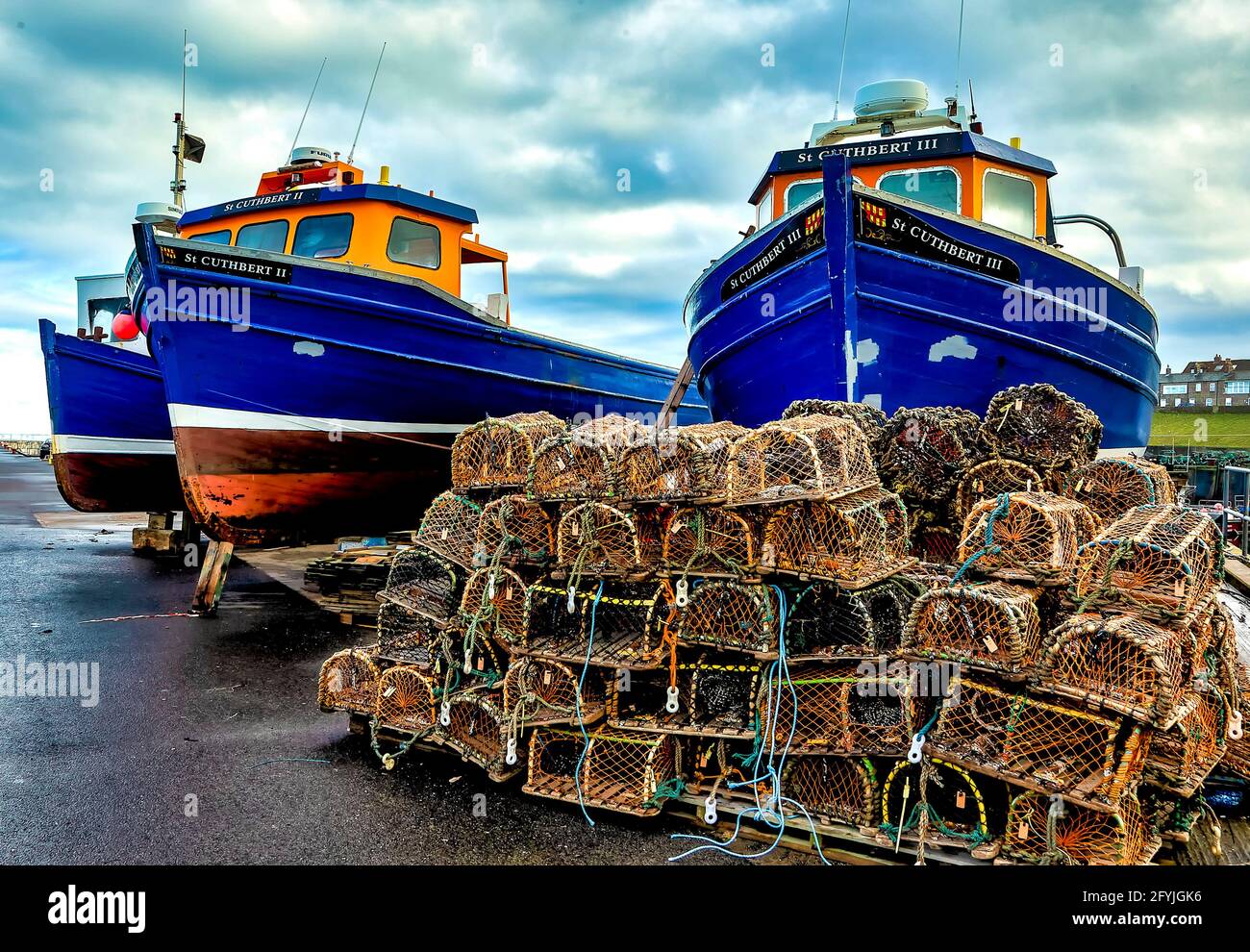 Fishing boats up out of the water on the dock at North Sunderland ...