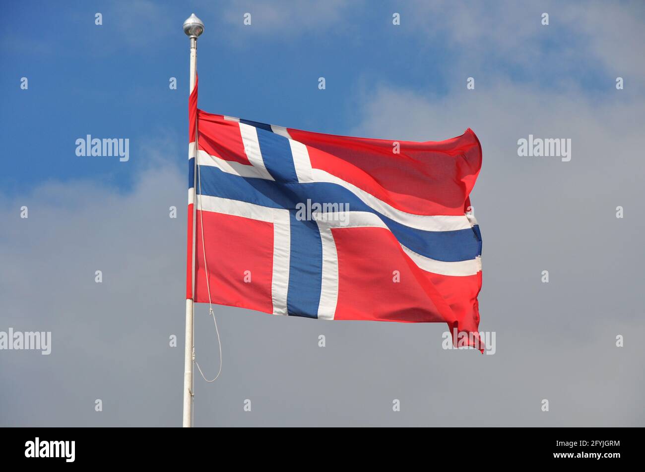 Norwegian patriotism: Flag of Norway on a pole waving in wind Stock ...