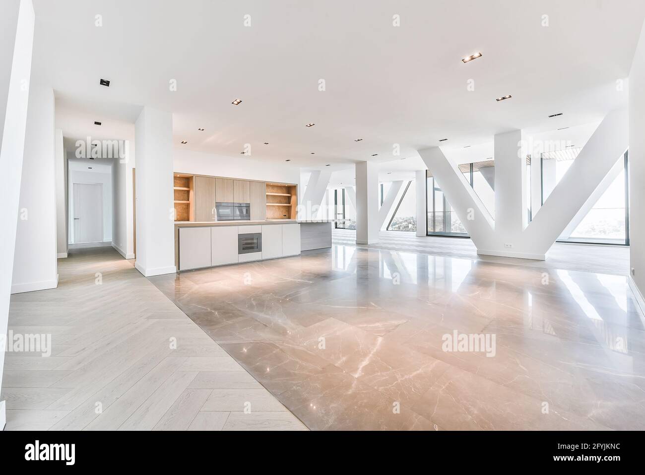 Interior of penthouse apartment with parquet and marble flooring and