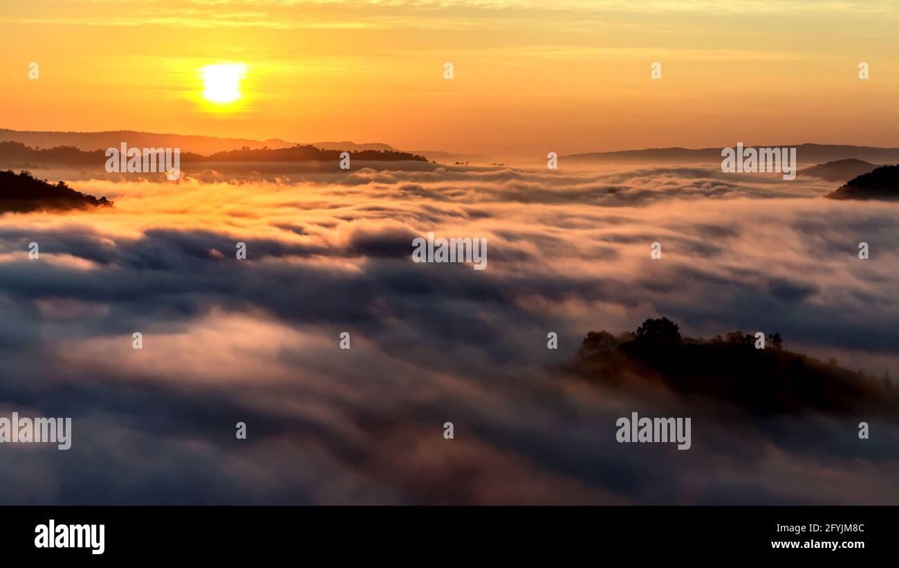 Sunrise and cloud carpet over mountain landscape, Nhong Khai, Thailand Stock Photo