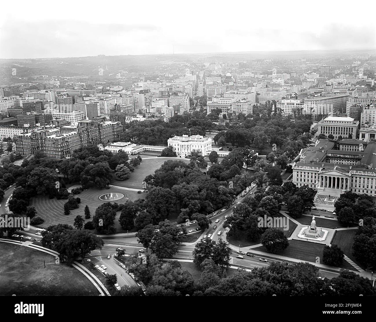 Aerial photo of Washington, D.C. and the North Front and South Rear of the White House taken from Lafayette Park in President's Park. Also included in the photograph are the Ellipse, Washington Monument, Jefferson Memorial, Executive Office Building, and the United States Department of the Treasury building. Stock Photo