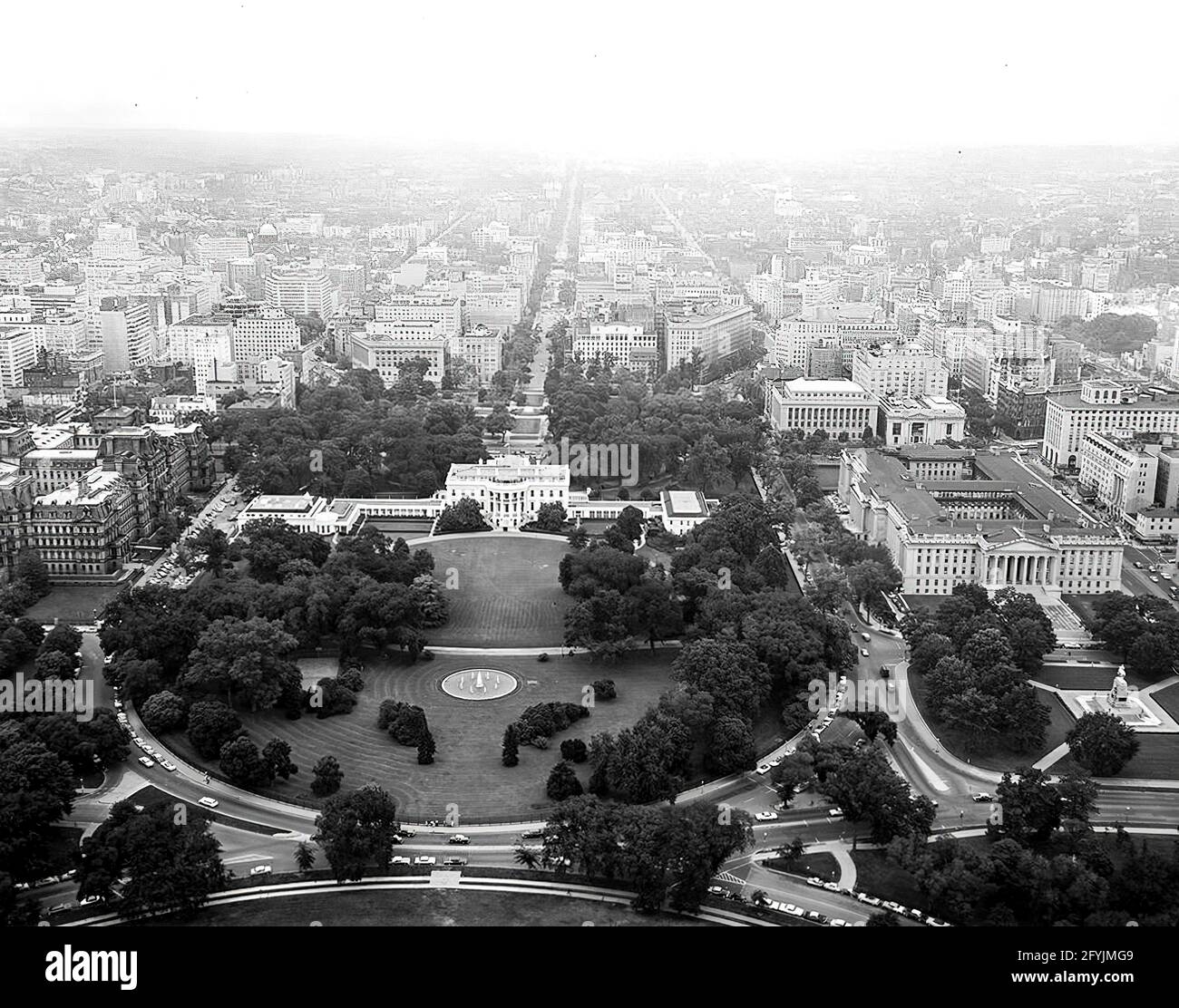 Aerial photo of Washington, D.C. and the North Front and South Rear of the White House taken from Lafayette Park in President's Park. Also included in the photograph are the Ellipse, Washington Monument, Jefferson Memorial, Executive Office Building, and the United States Department of the Treasury building. Stock Photo