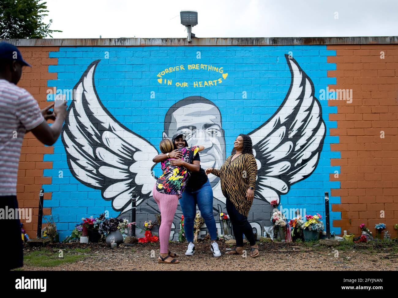 Bianca Williams is the niece of George Floyd got hugs from Marissa Scott, 30, and Alvina McThenney, 43, of Palm Bay, Florida. The two women work as traveling nurses working in Houston and wanted to see the George Floyd mural when they met Bianca Williams at the site and posed for pictures with her. (Photo by Carlos Gonzalez/Minneapolis Star Tribune/TNS/Sipa USA) Stock Photo