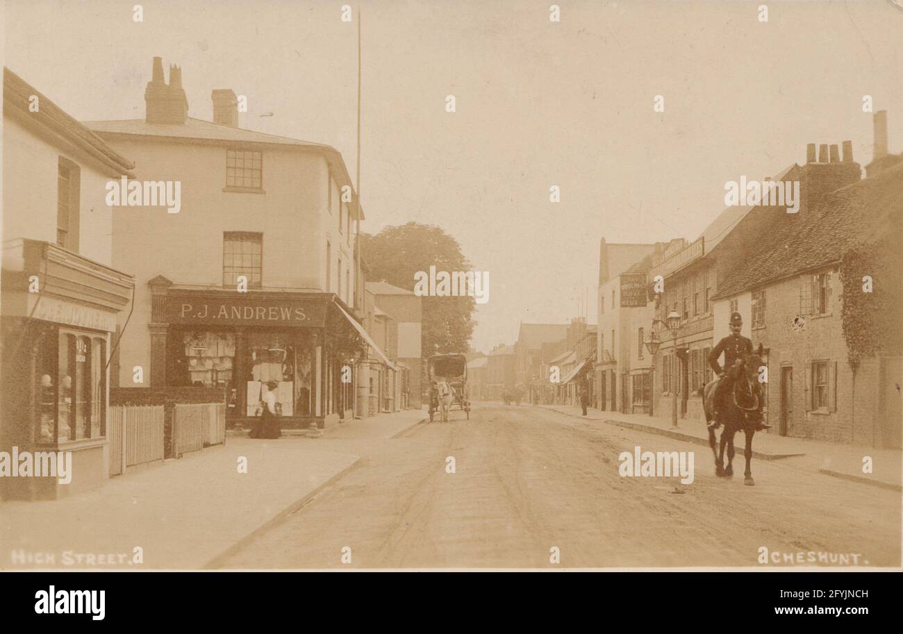 Vintage 1919 photographic postcard showing a mounted Policeman in the High Street, Cheshunt, Hertfordshire, England. Stock Photo