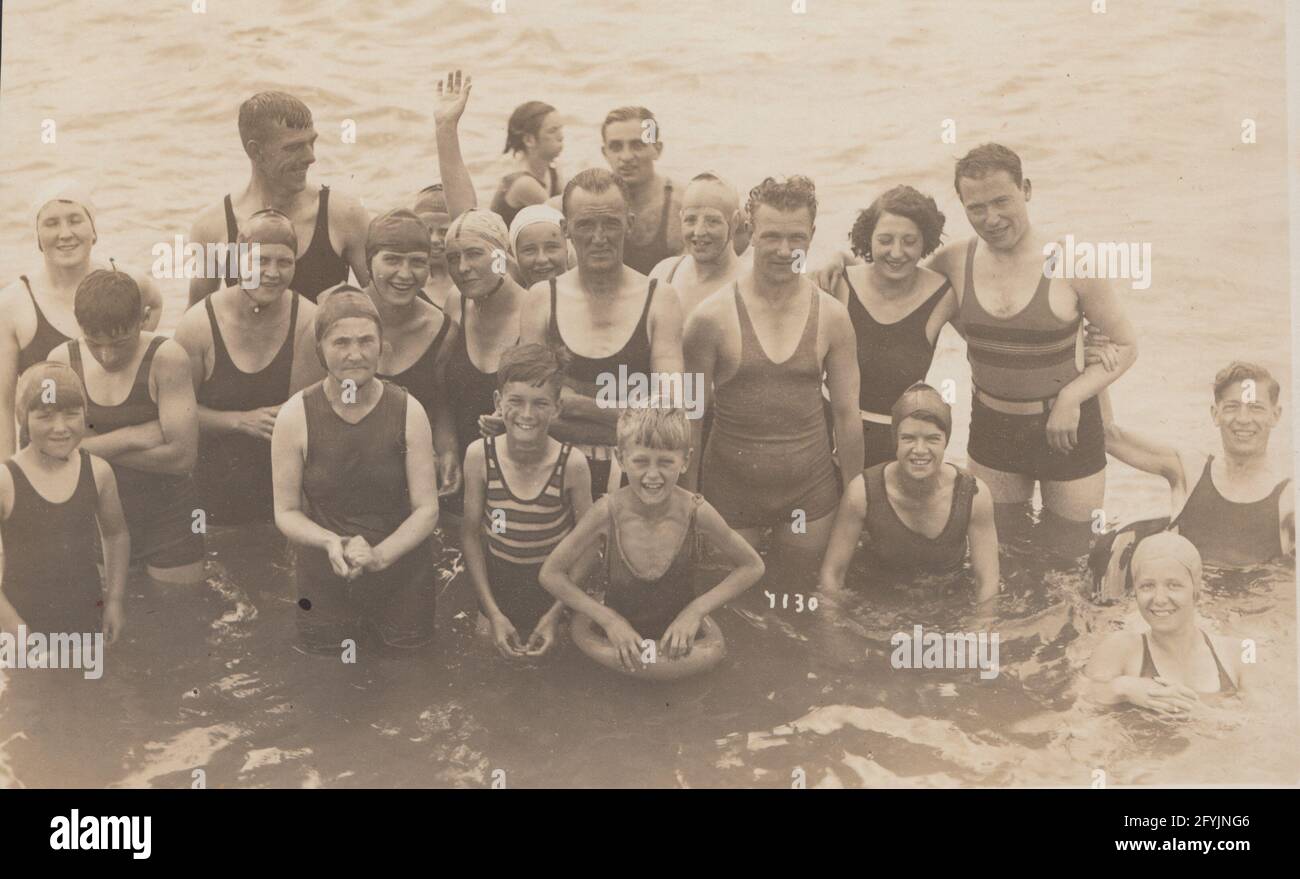 Vintage postcard showing a group of swimmers at Eastbourne, Sussex in 1932. Stock Photo