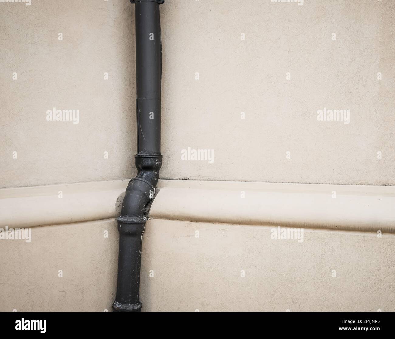 Black pipe on white wall with copy space Stock Photo Alamy