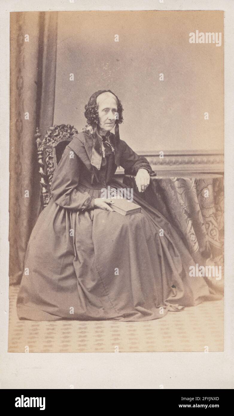 Victorian London CDV (Carte De Visite) Showing a Seated Elderly Lady Holding a Book. Stock Photo