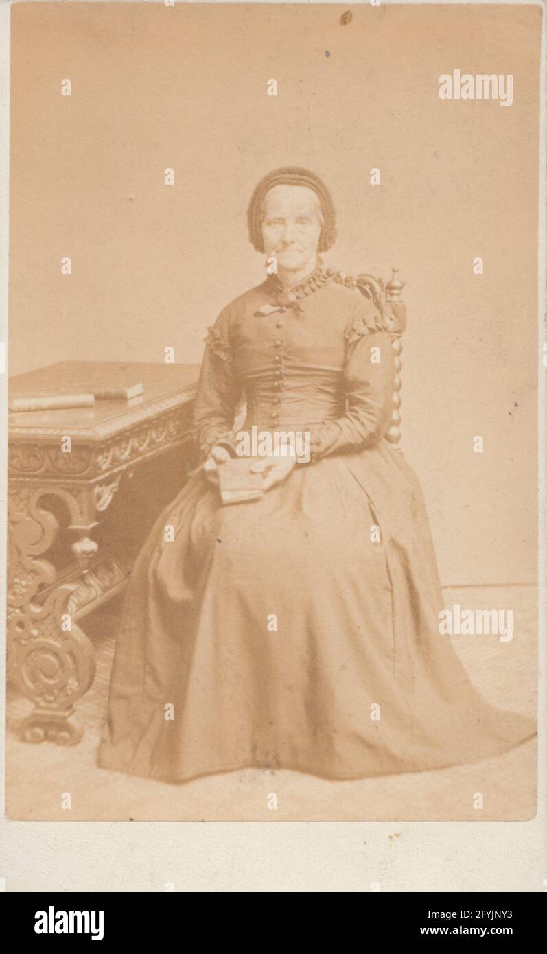 Victorian Ripon, Yorkshire CDV (Carte De Visite) Showing a Seated Lady Holding a Book. Stock Photo